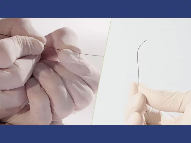 Gloved hand holding Drivewire