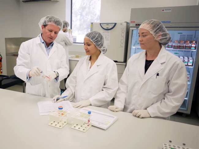 Orthocell CEO with employees in the lab