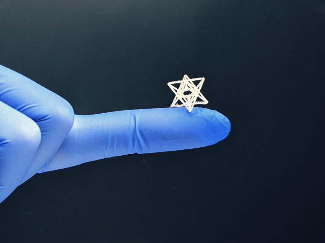 Tiny 3D-printed bioscaffold on gloved finger
