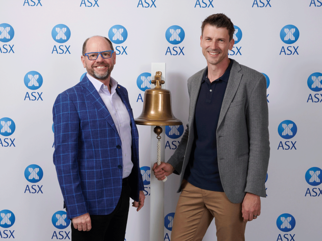 Artrya co-founders pose with bell, ASX backdrop