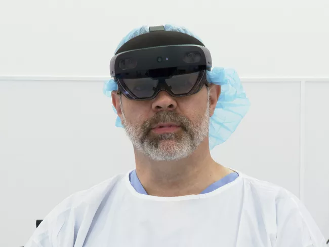 Surgeon wearing Arthrolense's mixed reality surgical guidance system