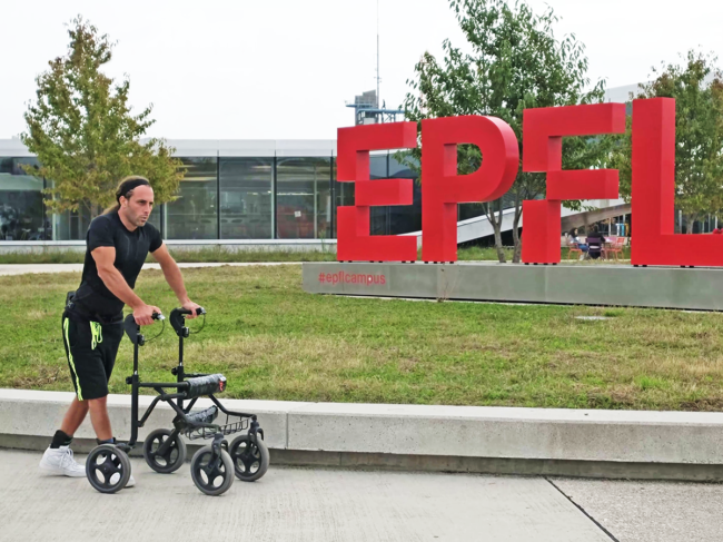 Man using walker near EPFL sign