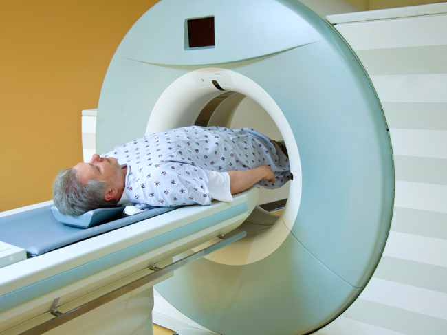 Man undergoing MRI scan for prostate cancer diagnosis