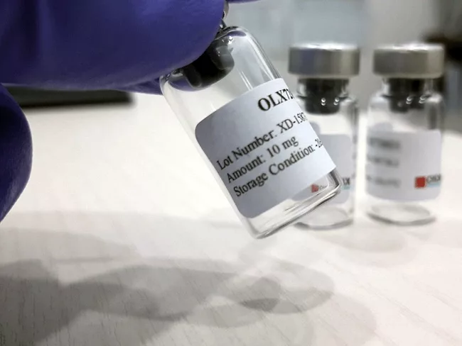 Vial of OLX-104C