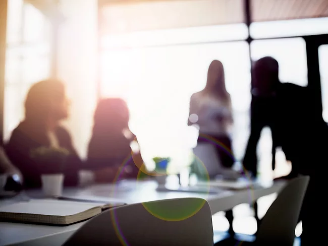 Employees in a meeting room 