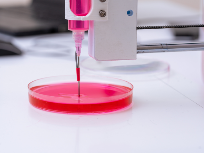 3D bioprinter printing cells onto an petri dish.