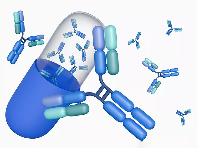 3D rendering of a drug capsule and flying antibodies