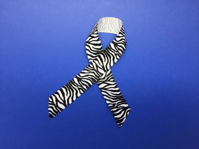 Awareness ribbon with zebra pattern