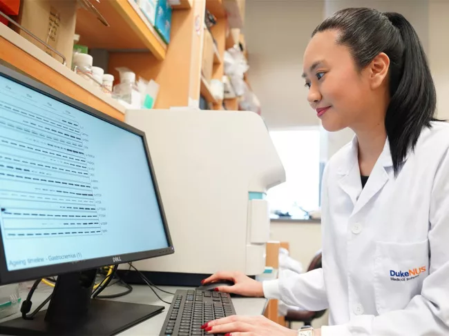 Dr. Widjaja viewing experimental data on the computer