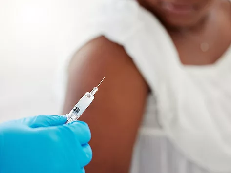 Woman receiving vaccine