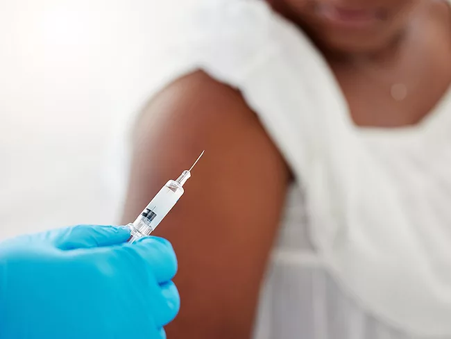 Woman receiving vaccine