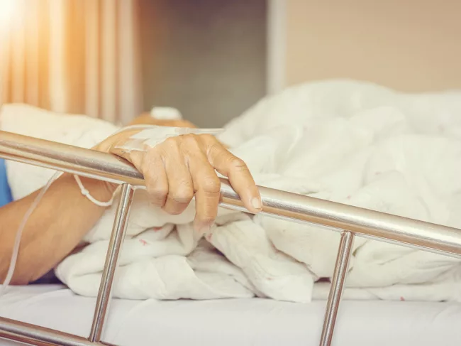 Elderly patient in hospital bed