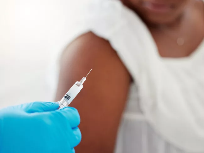 Woman receiving vaccine
