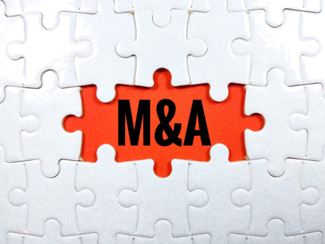 M&A letters over missing puzzle pieces