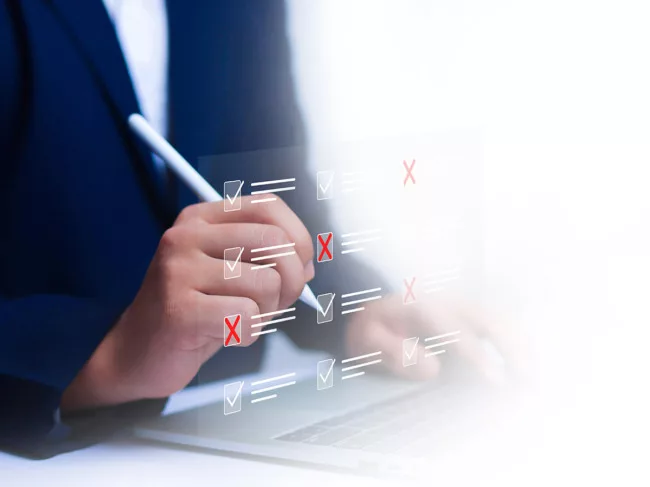 Businessperson completing checklist