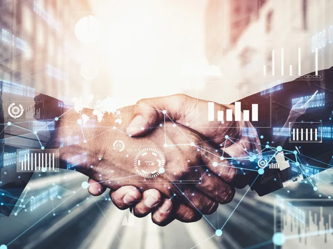 Handshake with charts, maps, data