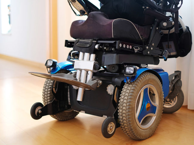 Powered wheelchair in hallway