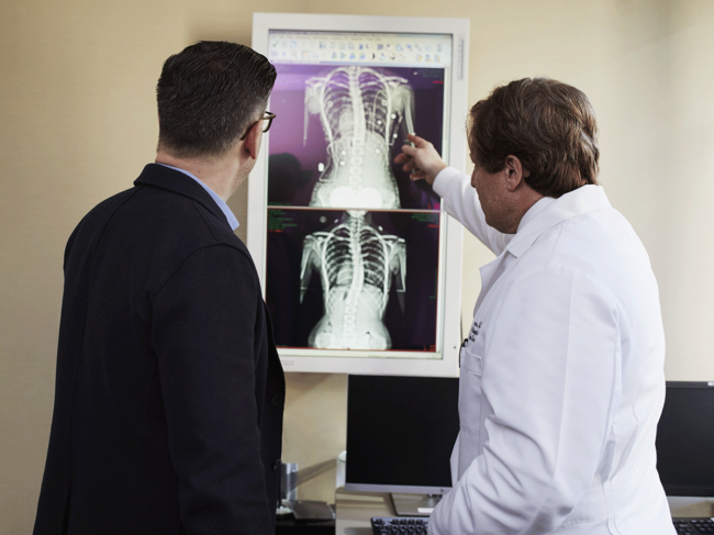 Men reviewing chest X-rays