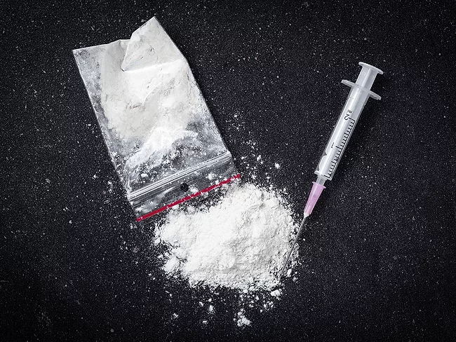 Cocaine, plastic bag and syringe