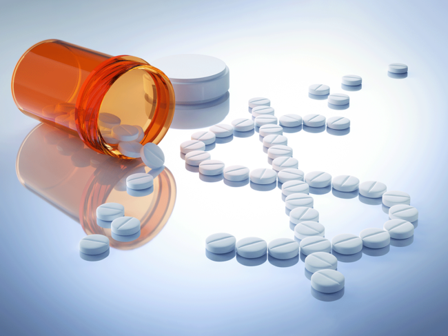 Prescription drug bottle, pills shaped in $ sign
