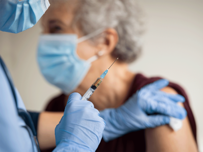 Older woman receiving vaccine