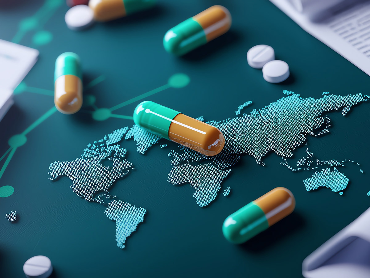 Capsules and tablets scattered over a world map