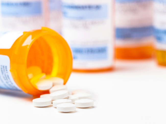 Prescription drug bottles and pills