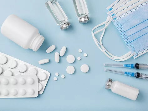 Vials syringes pills and masks