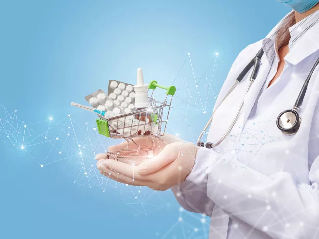 Doctor holding shopping cart of medicine