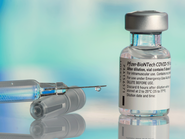 Pfizer-Biontech vaccine and syringe
