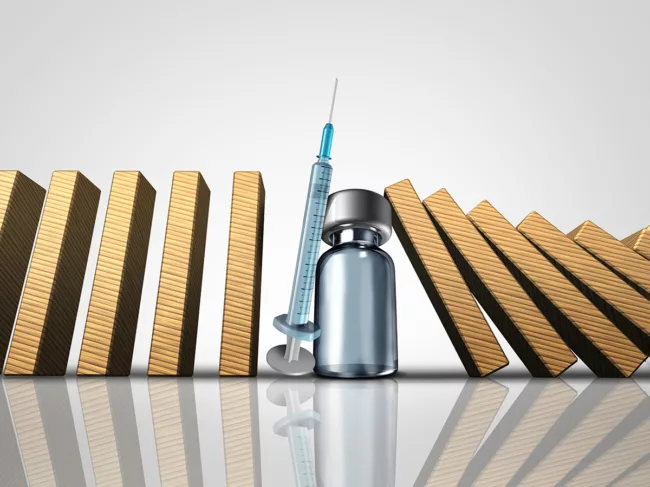 Vial and syringe in row of dominoes
