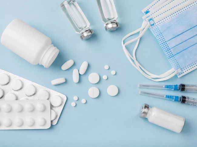 Vials, syringes, pills and masks