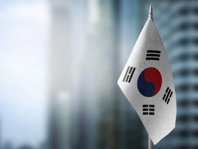Flag of South Korea with skyscrapers in the background 