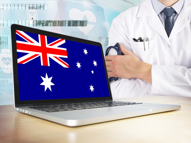 Australian flag on laptop screen with health professional