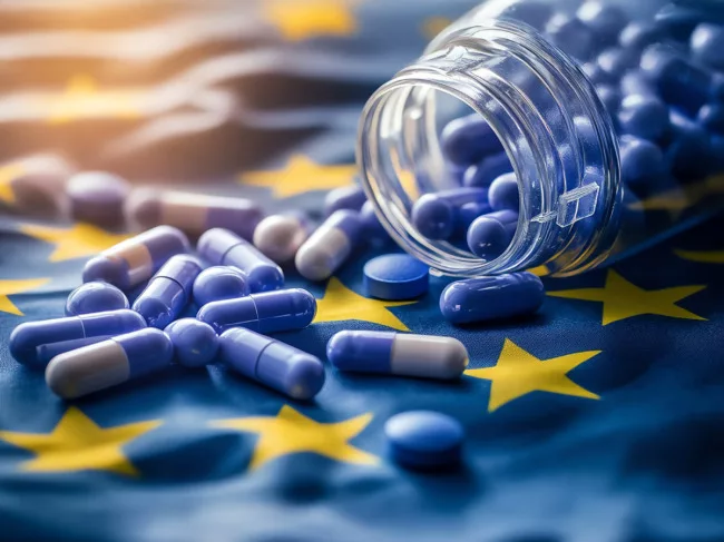 Pill bottle spilling over EU flag