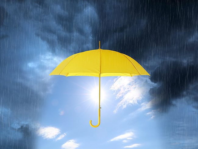 Yellow umbrella in a storm