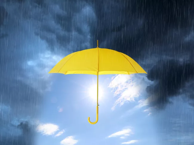 Yellow umbrella in a storm