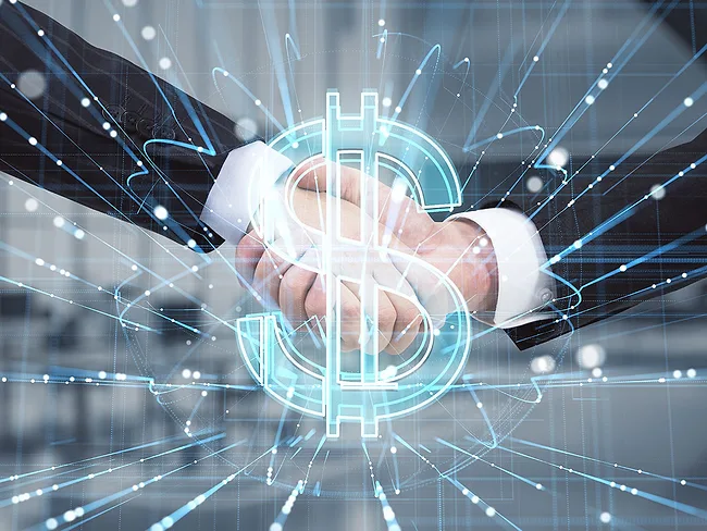 Business handshake and holographic dollar sign