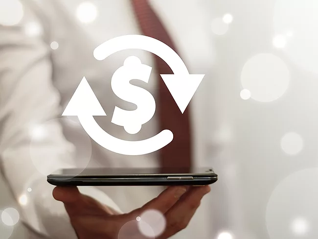 Hand holding smartphone with dollar sign, arrows hovering