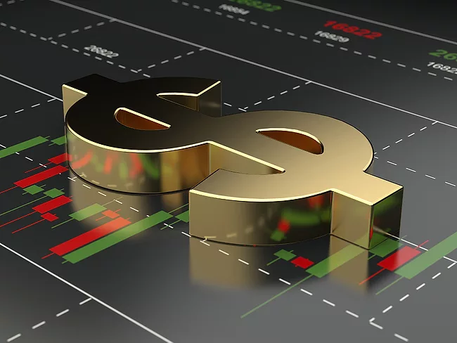 Dollar sign on financial stock market chart background