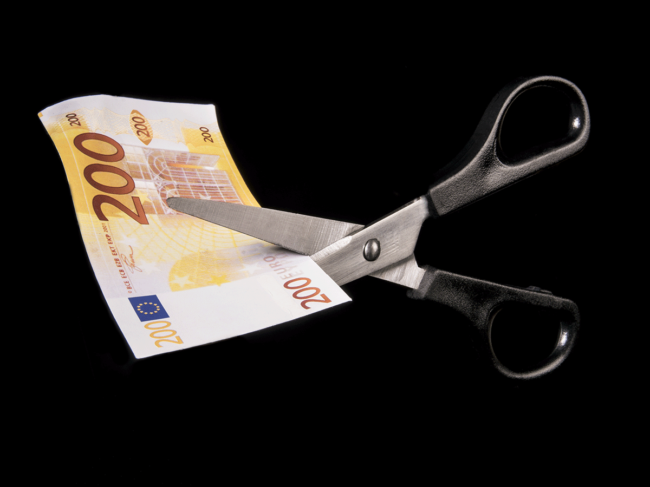 Scissors cutting Euro