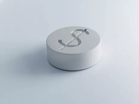 White tabletl with dollar sign imprint