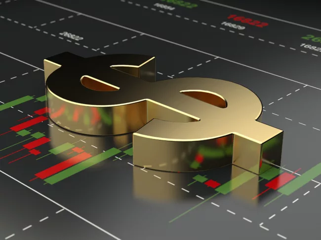 Dollar sign on financial stock market chart background