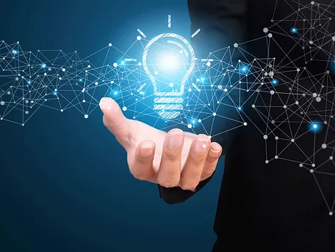 Newco idea hand holding lighbulb