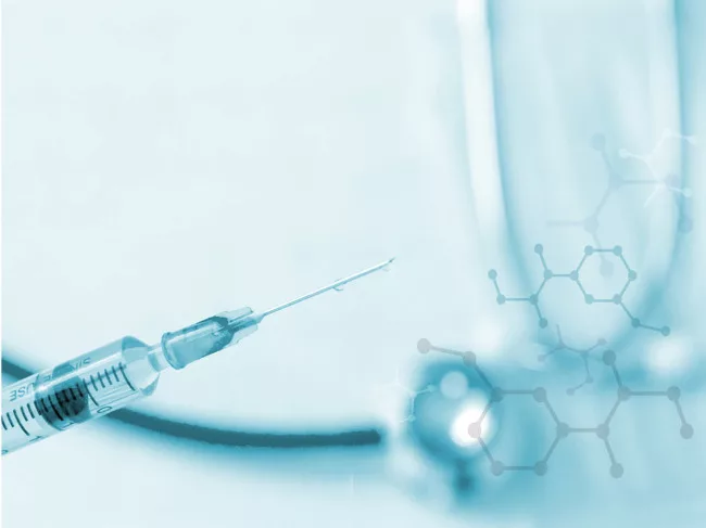 Syringe with illustration of molecules