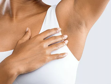 Hand held near armpit