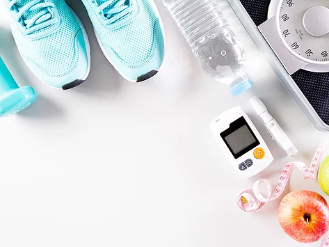 Hand weight, sneakers, scale, measuring tape, apple, injector and glucose monitor