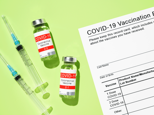 COVID-19 vial, syringe and vaccine card
