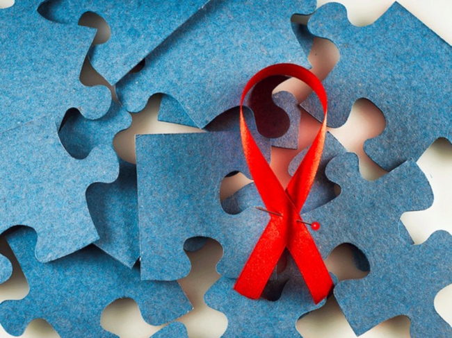 Blue puzzle pieces, red ribbon
