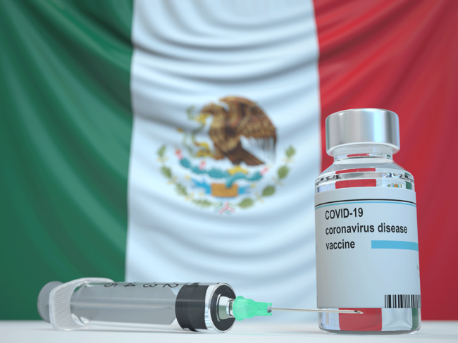 Mexican flag, coronavirus vaccine vial, syringe